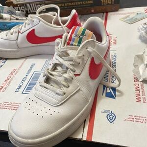Nike Kids White Sneakers with Red Swoosh and Rainbow Tongue